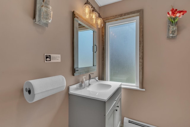 bathroom with vanity and a baseboard radiator