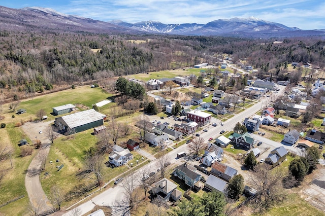 bird's eye view with a residential view, a mountain view, and a wooded view