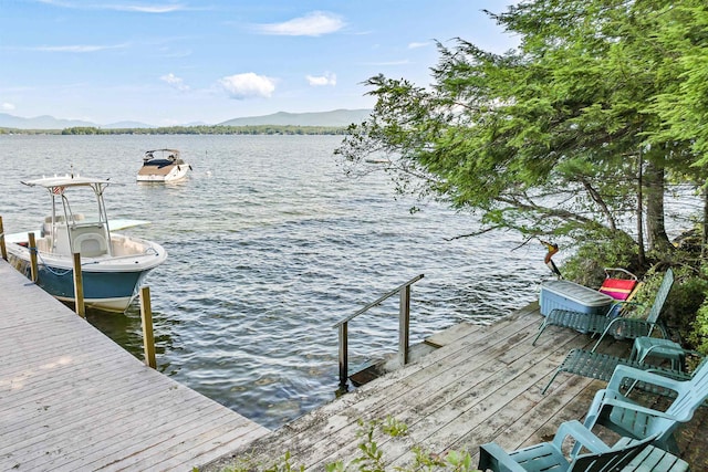 dock area featuring a water and mountain view