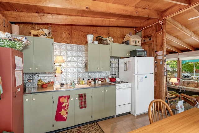 kitchen with beam ceiling, green cabinetry, white appliances, and wooden ceiling