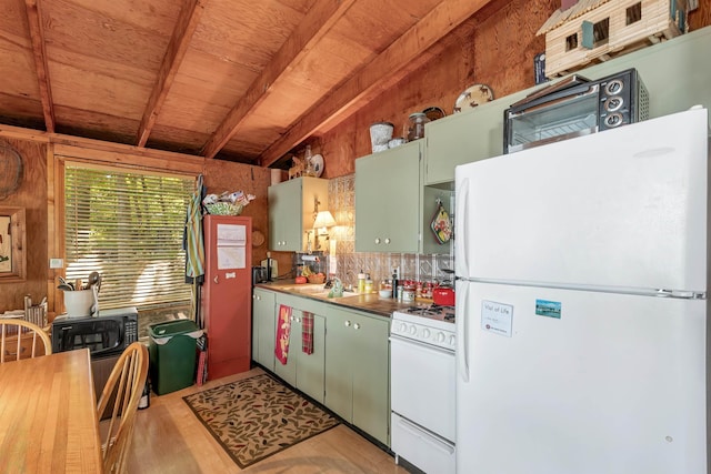kitchen with green cabinetry, tasteful backsplash, light wood-style floors, and white appliances