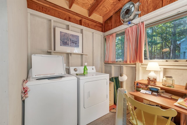 washroom with washer and clothes dryer and laundry area