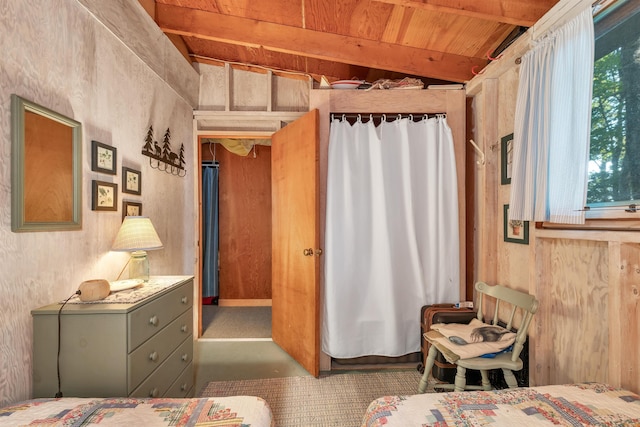 bedroom with wood ceiling, lofted ceiling with beams, and multiple windows