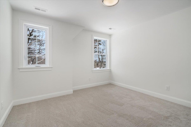 bonus room with plenty of natural light, baseboards, and carpet floors