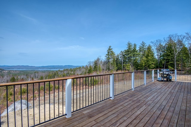 wooden terrace featuring a mountain view