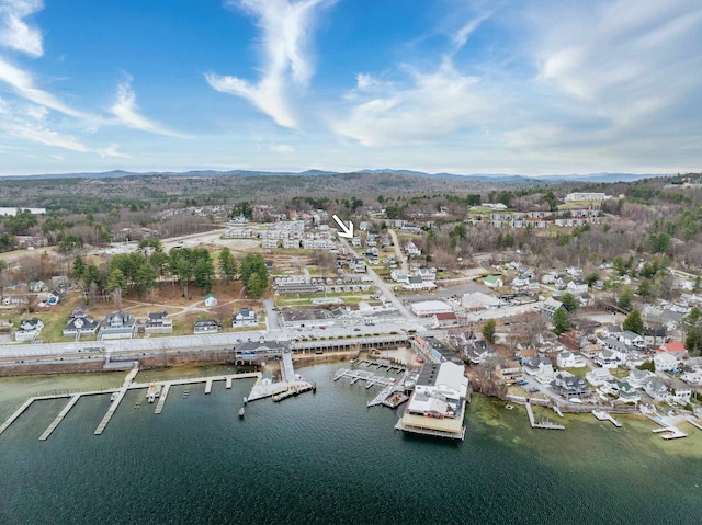 drone / aerial view featuring a water and mountain view