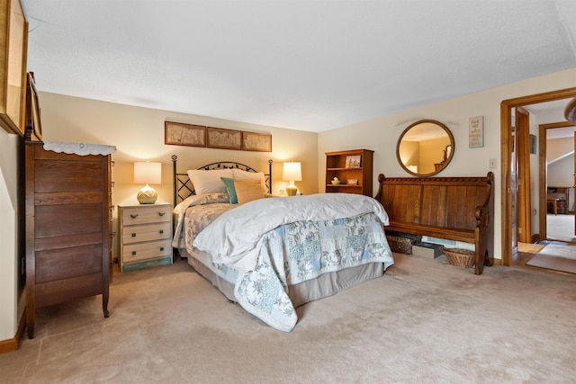 bedroom featuring light carpet