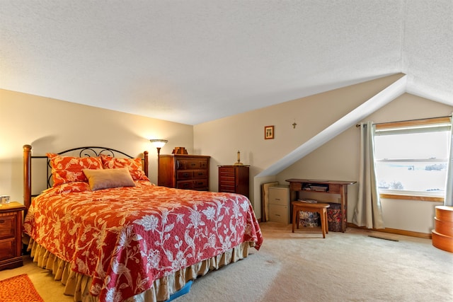 bedroom featuring lofted ceiling, carpet, and a textured ceiling