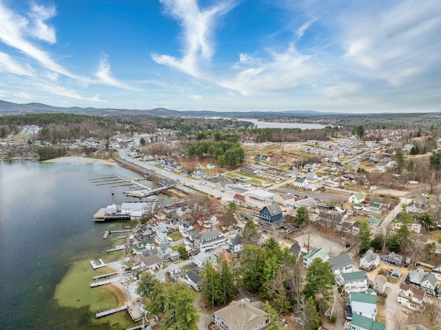 aerial view with a water and mountain view and a residential view