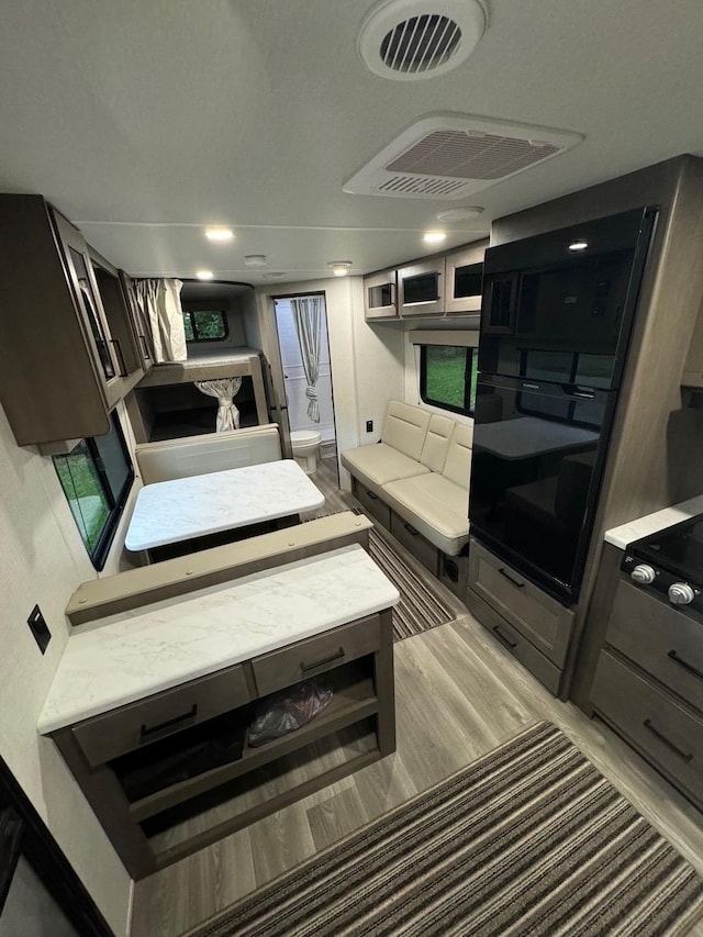 interior space featuring visible vents and light countertops