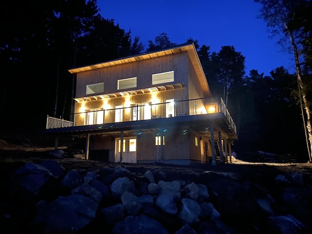 view of back of house at night