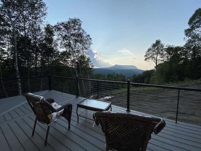 deck at dusk with a mountain view