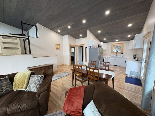living room with light wood-type flooring, vaulted ceiling, and wooden ceiling