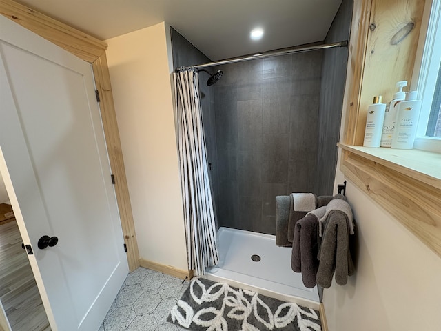 bathroom with recessed lighting, a shower stall, and vanity