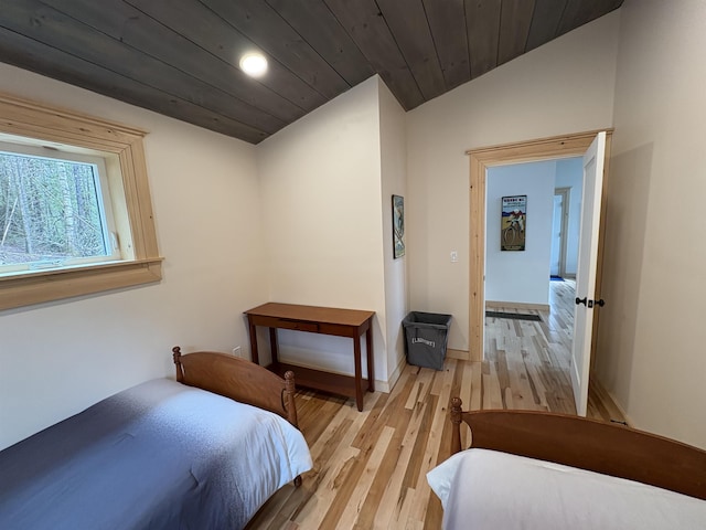bedroom featuring wood ceiling, wood finished floors, recessed lighting, and baseboards