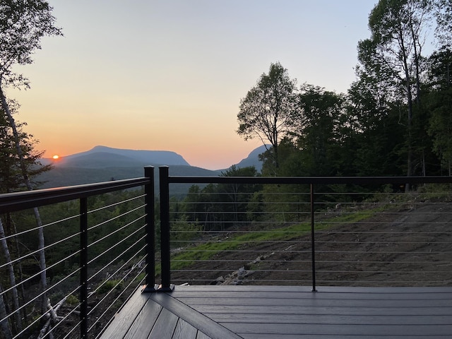 deck at dusk with a mountain view