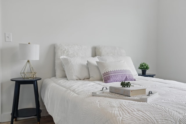 bedroom featuring wood finished floors