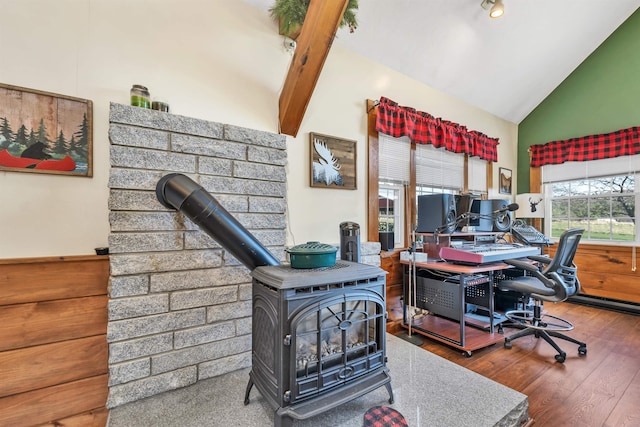 7449 School St, Loudon, NH 03307 - office space with wood finished floors, high vaulted ceiling, and a wood stove