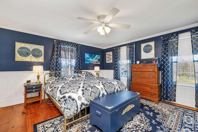 7449 School St, Loudon, NH 03307 - bedroom with hardwood / wood-style flooring, ceiling fan, a wainscoted wall, ornamental molding, and a decorative wall