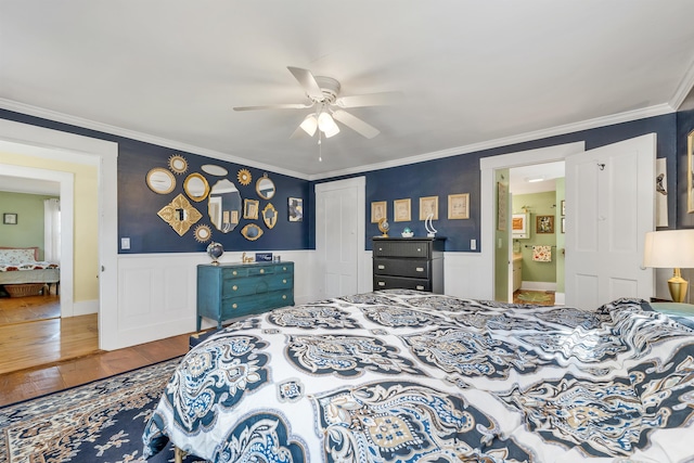 7449 School St, Loudon, NH 03307 - bedroom with wainscoting, ornamental molding, a closet, and wood-type flooring