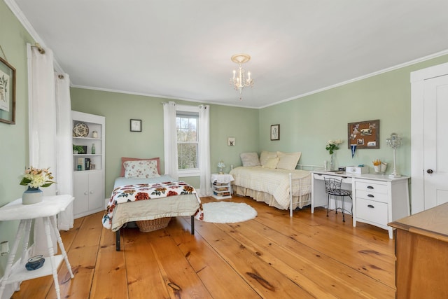 7449 School St, Loudon, NH 03307 - bedroom with ornamental molding, light wood finished floors, and a chandelier