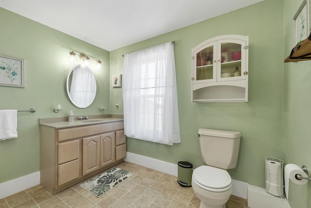 7449 School St, Loudon, NH 03307 - bathroom featuring vanity, toilet, and baseboards