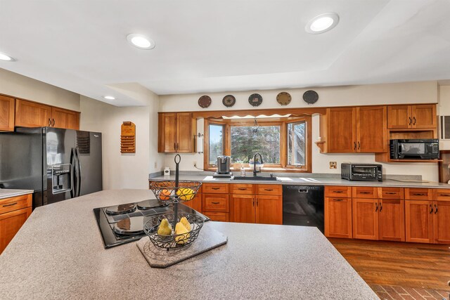7449 School St, Loudon, NH 03307 - kitchen featuring a sink, light countertops, black appliances, a toaster, and recessed lighting
