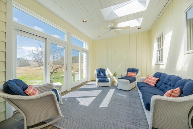 sunroom / solarium featuring wooden ceiling, a skylight, french doors, and recessed lighting