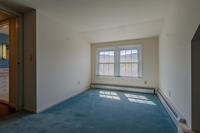 spare room with lofted ceiling, a baseboard radiator, carpet flooring, and baseboards