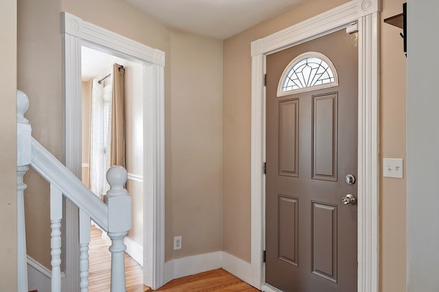 entrance foyer with light wood-style floors and baseboards