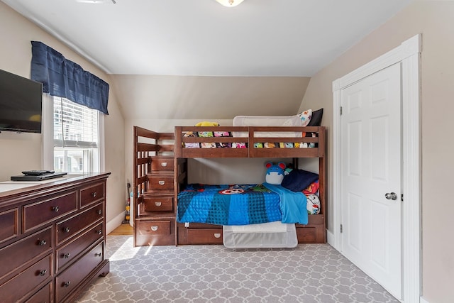 bedroom featuring vaulted ceiling