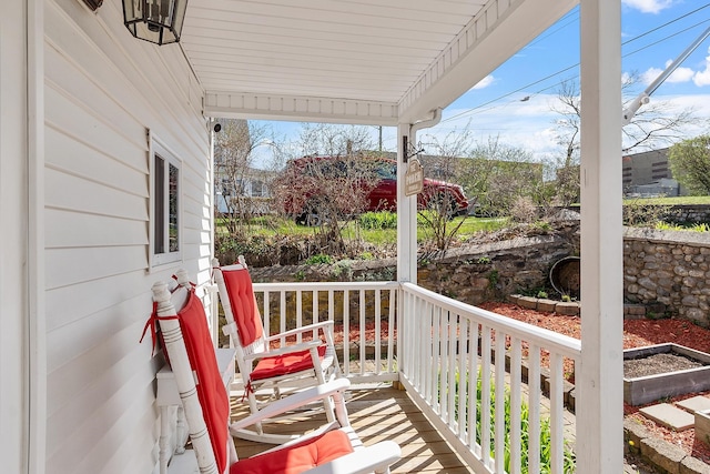 balcony featuring a porch