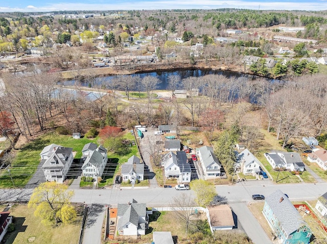 bird's eye view featuring a water view and a residential view