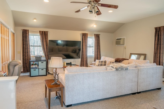 living room featuring light colored carpet, a wealth of natural light, a ceiling fan, and vaulted ceiling