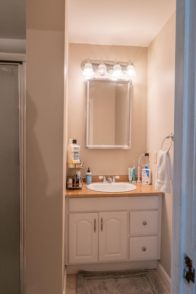 bathroom featuring vanity and baseboards