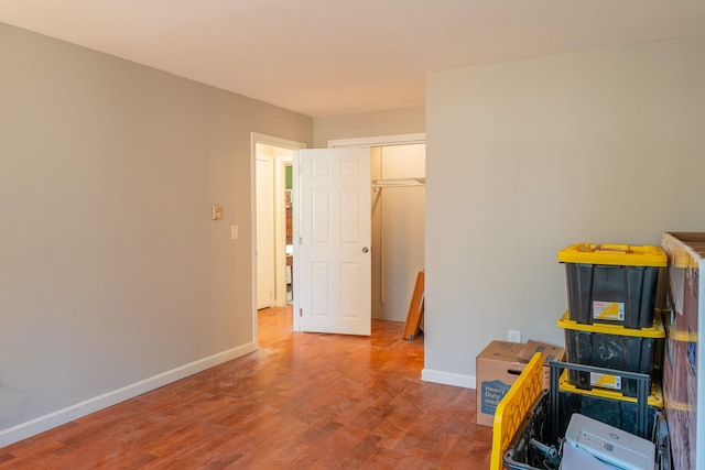 rec room featuring wood finished floors and baseboards