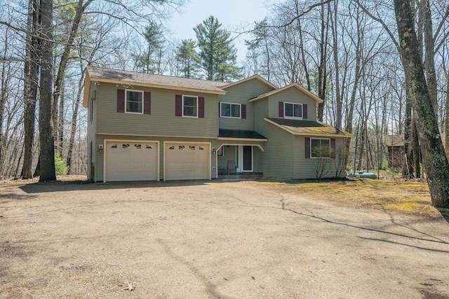 view of front of property featuring driveway and an attached garage