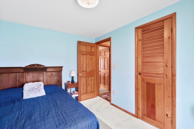 bedroom featuring carpet flooring and baseboards