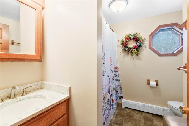 bathroom featuring curtained shower, toilet, vanity, and a baseboard radiator