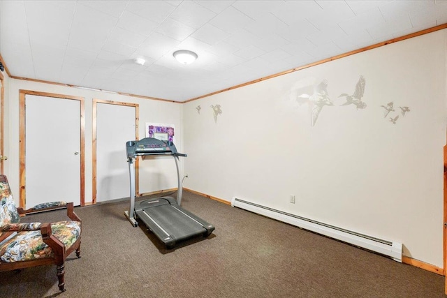 exercise room featuring baseboards, ornamental molding, a baseboard heating unit, and carpet flooring