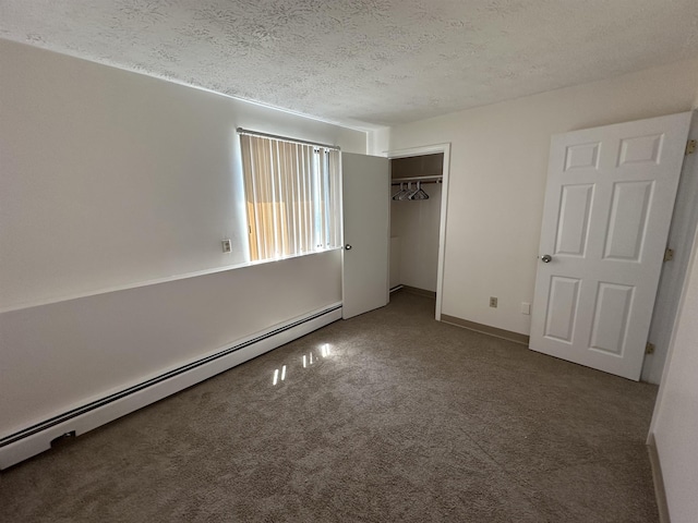 unfurnished bedroom featuring a baseboard radiator, a closet, a textured ceiling, and carpet floors