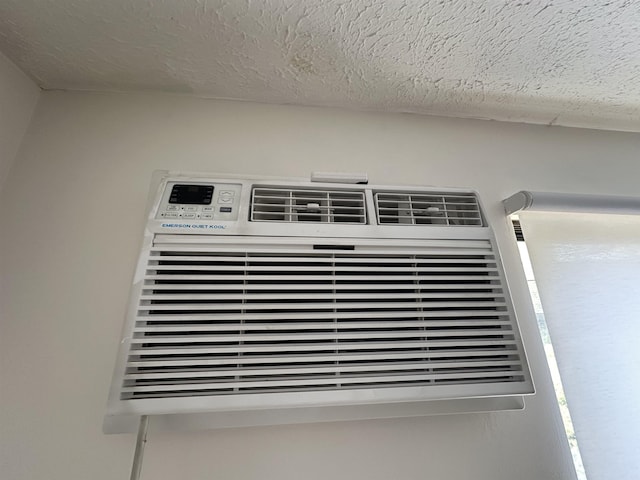 interior details featuring a textured ceiling