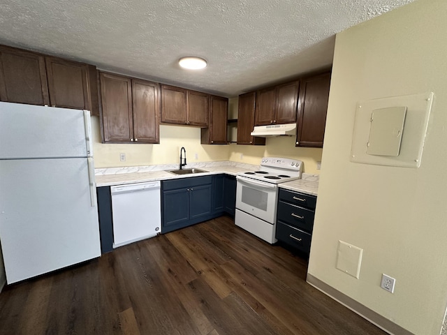 kitchen featuring a sink, under cabinet range hood, white appliances, light countertops, and a textured ceiling