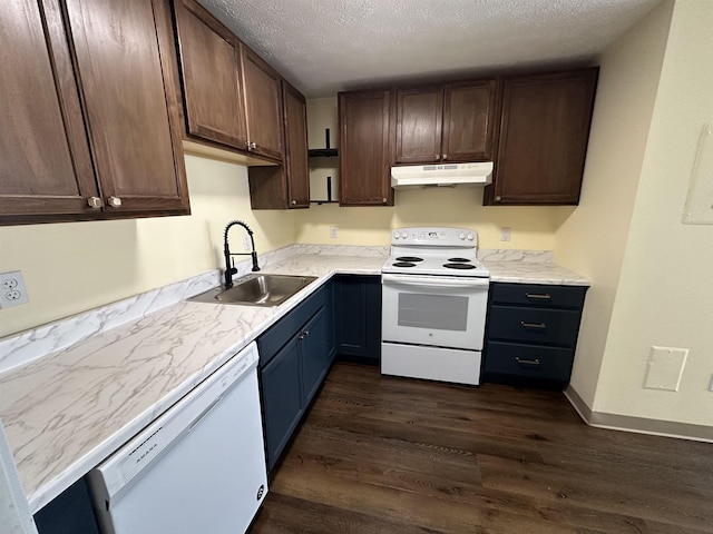 kitchen with a sink, dark wood-style flooring, under cabinet range hood, white appliances, and a textured ceiling