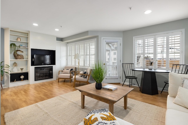 living room featuring wood finished floors and recessed lighting