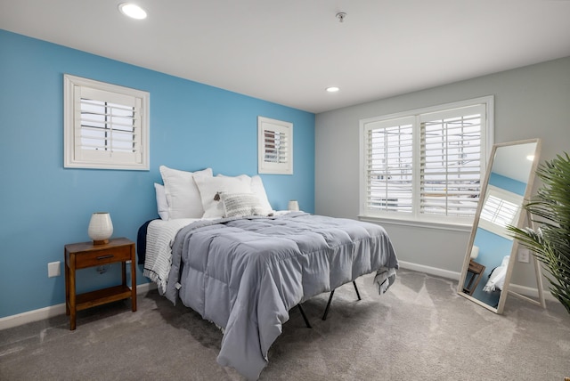 carpeted bedroom featuring recessed lighting and baseboards