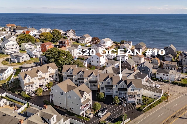 bird's eye view featuring a water view and a residential view