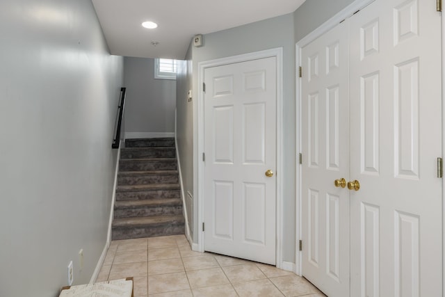 stairs with recessed lighting, tile patterned flooring, and baseboards