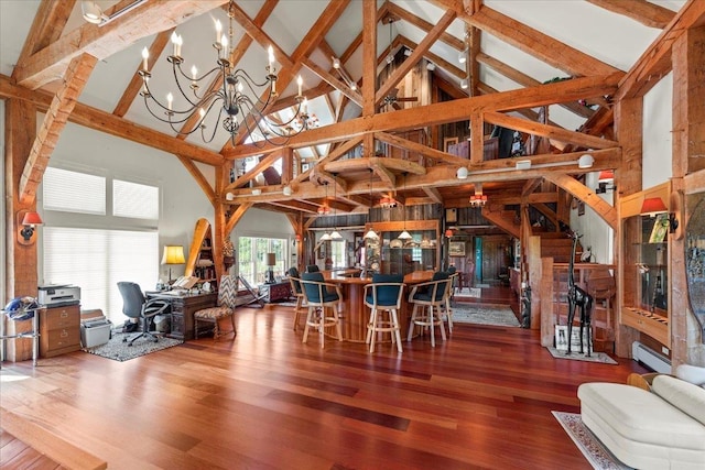 dining room with a notable chandelier, baseboard heating, beam ceiling, wood finished floors, and high vaulted ceiling