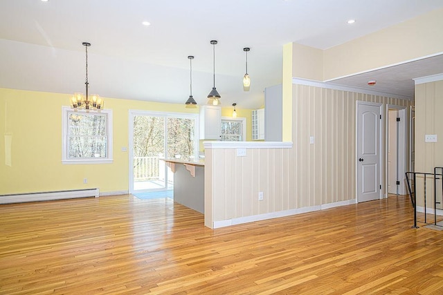 24 Hampton Falls Rd, Exeter, NH 03833 - kitchen with baseboard heating, light wood-style flooring, a chandelier, baseboards, and hanging light fixtures